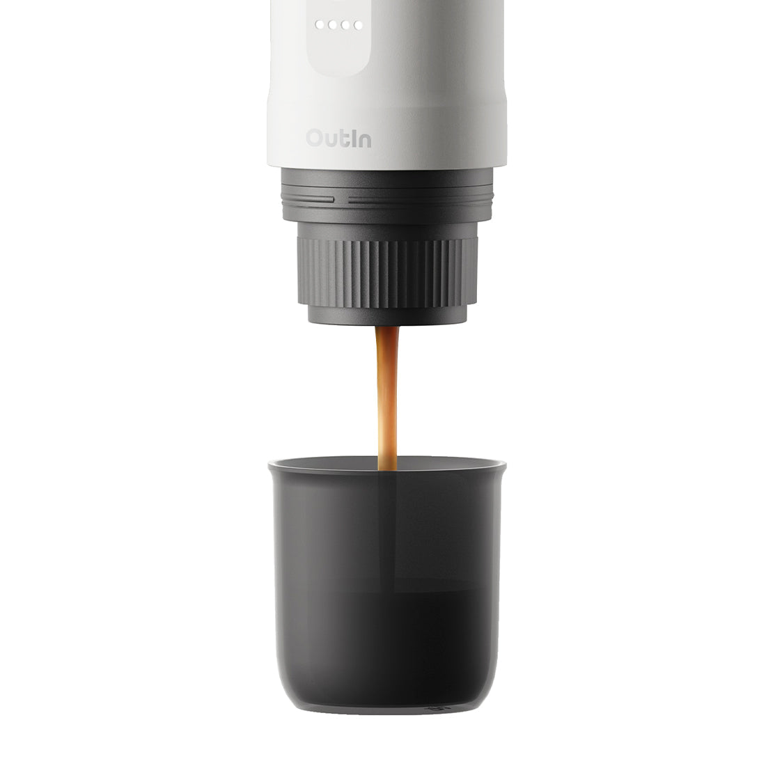 Espresso pouring from Nano Portable Espresso Machine into a black cup.