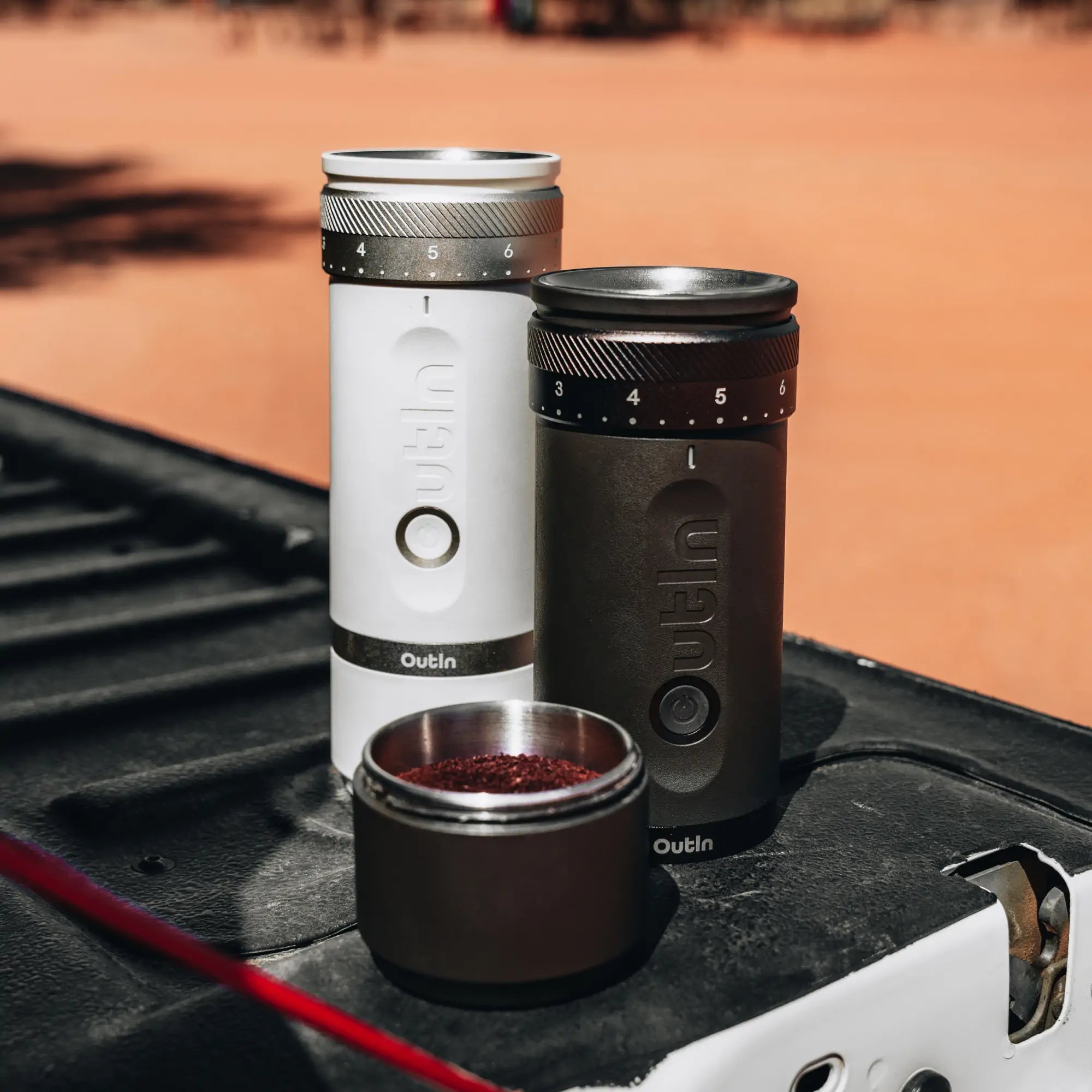 Outin Fino portable coffee grinders in white and black
